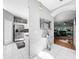 Hallway featuring tile floors and entry to the kitchen and living room at 14 Seagrape Cir, Clearwater, FL 33759