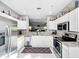 Kitchen featuring stainless steel appliances, modern cabinetry, and granite countertops at 14 Seagrape Cir, Clearwater, FL 33759