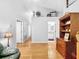 Bright living room boasts hardwood floors, and open layout with views into a tiled bathroom at 14 Seagrape Cir, Clearwater, FL 33759