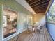 Relaxing screened patio with dining set offers beautiful views at 14 Seagrape Cir, Clearwater, FL 33759