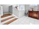 Staircase featuring decorative cabinets, and tile floors at 14 Seagrape Cir, Clearwater, FL 33759