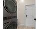 This is the laundry room featuring a sleek, modern washer and dryer set at 12524 25Th E Ct, Parrish, FL 34219