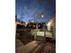 Exterior deck with lights and view to backyard at dusk at 1564 S Michigan Ave, Clearwater, FL 33756