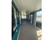 Enclosed porch with big windows and view to the outside at 1564 S Michigan Ave, Clearwater, FL 33756