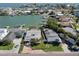 Aerial view of waterfront homes with docks and boat access on a sunny day at 16103 4Th E St, Redington Beach, FL 33708