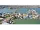 Wide aerial view of waterfront properties highlighting community and access to the waterway at 16103 4Th E St, Redington Beach, FL 33708