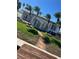 Exterior of waterfront home, green lawn, and walkway to the dock at 16103 4Th E St, Redington Beach, FL 33708