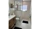 Modern bathroom featuring a glass-enclosed shower, sleek vanity, and stylish tile work, offering a spa-like experience at 16103 4Th E St, Redington Beach, FL 33708