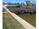 Waterfront view of a private dock, offering direct access to boating and water activities, and a sunny location at 16103 4Th E St, Redington Beach, FL 33708