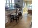 Kitchen bar with stone accents, comfortable bar stools, and hardwood floors for a stylish culinary space at 16103 4Th E St, Redington Beach, FL 33708