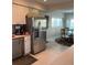 Bright kitchen features stainless steel appliances, white cabinetry, and eat in dining area at 16103 4Th E St, Redington Beach, FL 33708