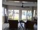 Comfortable living room with water view, ceiling fan, and large sliding doors to backyard at 16103 4Th E St, Redington Beach, FL 33708