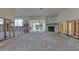Spacious living room featuring a fireplace and waterfront view ready for renovation to your preferences at 16103 4Th E St, Redington Beach, FL 33708