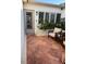 Inviting patio with brick flooring, comfortable seating and lush greenery, perfect for outdoor relaxation at 16103 4Th E St, Redington Beach, FL 33708