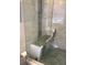 Stylish shower features marble walls with accent stones and a built-in bench at 16103 4Th E St, Redington Beach, FL 33708