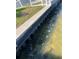 Waterfront view with seawall and green grass at 16103 4Th E St, Redington Beach, FL 33708