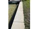 Concrete seawall next to a grassy lawn and the waterway at 16103 4Th E St, Redington Beach, FL 33708