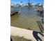 Waterfront view with clear, calm water, docks, and boats, promising a serene living environment at 16103 4Th E St, Redington Beach, FL 33708