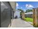 Backyard view from the screened in porch with view of the fence line at 211 Somerset Cirle N, Dunedin, FL 34698