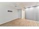 Bedroom features light wood flooring, a large closet and a ceiling fan at 211 Somerset Cirle N, Dunedin, FL 34698