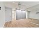 Bedroom boasts light wood flooring, mirrored wall and a large closet for ample storage space at 211 Somerset Cirle N, Dunedin, FL 34698