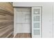 A closet with sliding doors and wire shelving at 211 Somerset Cirle N, Dunedin, FL 34698