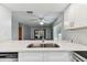 Beautiful kitchen with a stainless steel sink and modern countertops overlooking the living area at 211 Somerset Cirle N, Dunedin, FL 34698