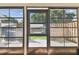 View from lanai showing the fenced backyard at 211 Somerset Cirle N, Dunedin, FL 34698
