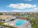 Overhead shot showcases community pool and surrounding buildings and amenities at 2400 Franciscan Dr # 34, Clearwater, FL 33763