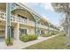 Inviting condo complex with manicured lawns, pedestrian walkways, and classic architectural design at 2400 Franciscan Dr # 34, Clearwater, FL 33763