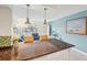 Bright kitchen features granite countertops, white cabinetry, modern appliances, a breakfast bar, and open access to the living area at 2400 Franciscan Dr # 34, Clearwater, FL 33763