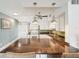 Bright kitchen features granite countertops, white cabinetry, modern appliances, and a center island with pendant lighting at 2400 Franciscan Dr # 34, Clearwater, FL 33763