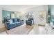Comfortable living room with bright walls, plush seating, and scenic outdoor view at 2400 Franciscan Dr # 34, Clearwater, FL 33763