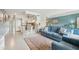 Open-concept living space showcasing a cozy living area adjacent to a modern kitchen with counter seating at 2400 Franciscan Dr # 34, Clearwater, FL 33763