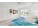Bright main bedroom features tile floors, a ceiling fan, and a sunroom with lots of natural light at 2400 Franciscan Dr # 34, Clearwater, FL 33763