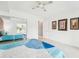 Bright main bedroom features tile floors, a ceiling fan, and a mirrored closet to enhance natural light at 2400 Franciscan Dr # 34, Clearwater, FL 33763