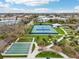 Aerial view of community tennis and shuffleboard setup at 2400 Franciscan Dr # 34, Clearwater, FL 33763