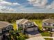 Aerial view of a well-maintained home with mature landscaping and expansive backyard at 3150 Marine Grass Dr, Wimauma, FL 33598