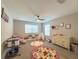 A neutral colored Bedroom with lots of natural light and a crib at 3150 Marine Grass Dr, Wimauma, FL 33598