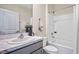 Bathroom featuring single sink with white marble countertops, a shower-tub combo and white walls at 3324 Ivy Hollow Dr, Plant City, FL 33565