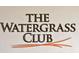 Close-up of The Watergrass Club signage at 33846 Floating Heart Ct, Wesley Chapel, FL 33545