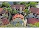 Aerial view of townhouse community showcasing mature trees and manicured landscaping at 3460 Countryside Blvd # 19, Clearwater, FL 33761