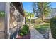 The backyard offers a brick path leading to the fire pit and mature landscaping at 3460 Countryside Blvd # 19, Clearwater, FL 33761