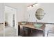 Elegant bathroom featuring dual vanities with vessel sinks, granite countertops, and decorative mirrors at 3460 Countryside Blvd # 19, Clearwater, FL 33761