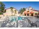 Inviting community pool area with a hot tub surrounded by well-maintained landscaping at 3460 Countryside Blvd # 19, Clearwater, FL 33761