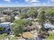 Overhead view of a home with a large front yard in a neighborhood full of mature trees at 3607 S Hubert Ave, Tampa, FL 33629