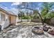 The backyard has a stone fire pit and patio at 3607 S Hubert Ave, Tampa, FL 33629