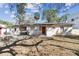 Rear exterior featuring a quaint patio, perfect for outdoor relaxation and entertainment at 3607 S Hubert Ave, Tampa, FL 33629