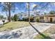 The front yard is large with a stately tree in this single Gathering home at 3607 S Hubert Ave, Tampa, FL 33629