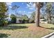 A well-maintained lawn fronts this home, accented by mature trees and manicured shrubs at 3607 S Hubert Ave, Tampa, FL 33629